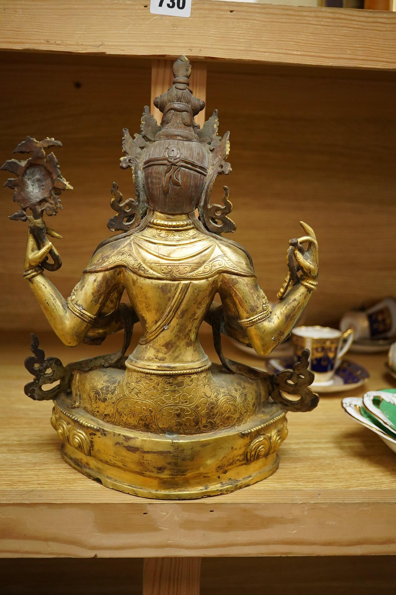 A large Sino Tibetan gilt bronze figure of Avalokiteshvara, 31cm high